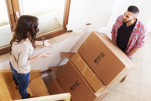Organized storage space in Wapping with boxed belongings and furniture